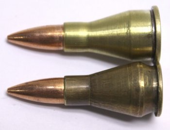 A photo of the .22 Tuba II, a novelty firearm cartridge based on the .45 ACP and .44 Magnum, depending on version.